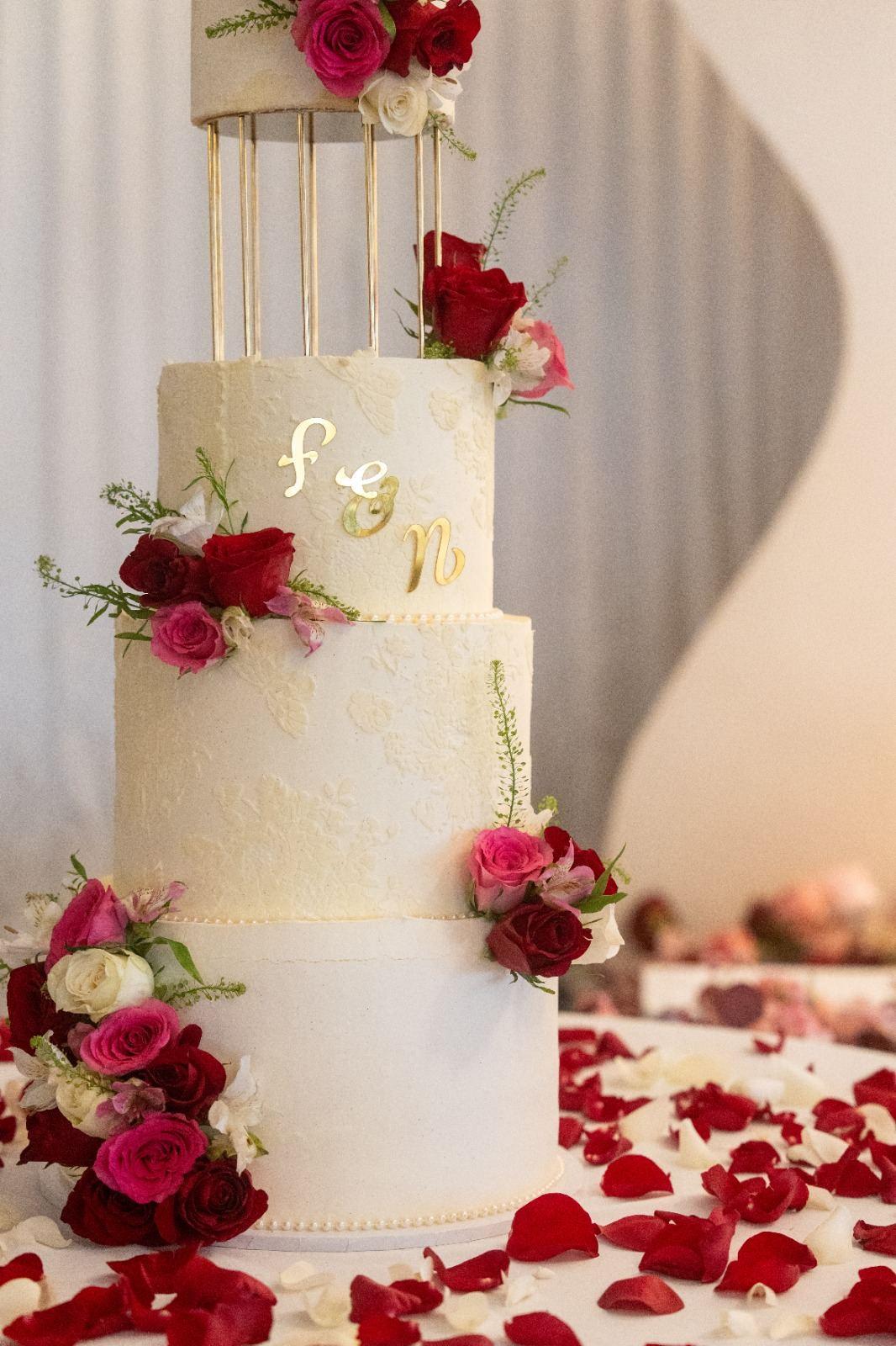 Elegant tiered wedding cake with monogram detail